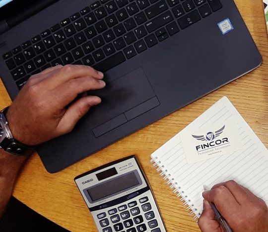 Laptop, hands with calculator